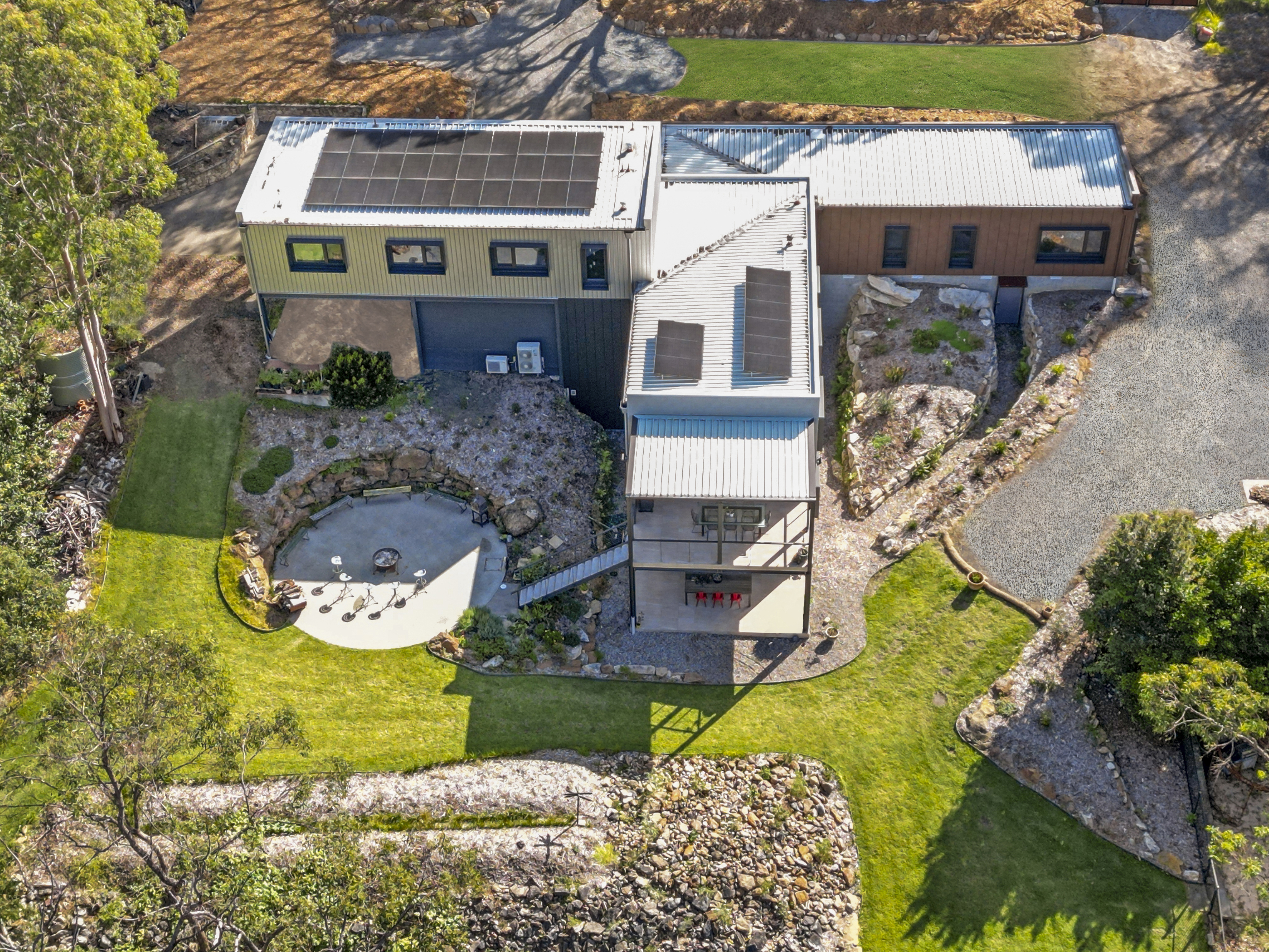 With a high bushfire attack level (BAL) rating and conscious design with respect to the natural surrounds, the Yellow Rock home harmonises with the existing environment. Photo: Open2View. 